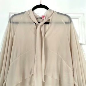 This top is a very feminine tiered flowy lightweight blouse!